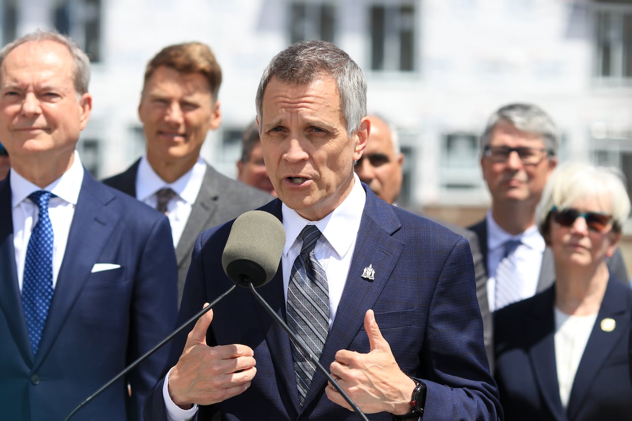 Mark Sutcliffe talking at a podium