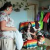 Misty Pipe (left) delivers a care package for a mom she recently supported through pregnancy, Britney WolfVoice. Pipe offers free doula care because Lame Deer — her hometown on the Northern Cheyenne Indian Reservation in Montana — is about 100 miles from the closest hospital that delivers babies.