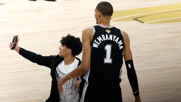 NBA bans pair of fans for life after one attempted on-court selfie with Wembanyama during Game 1