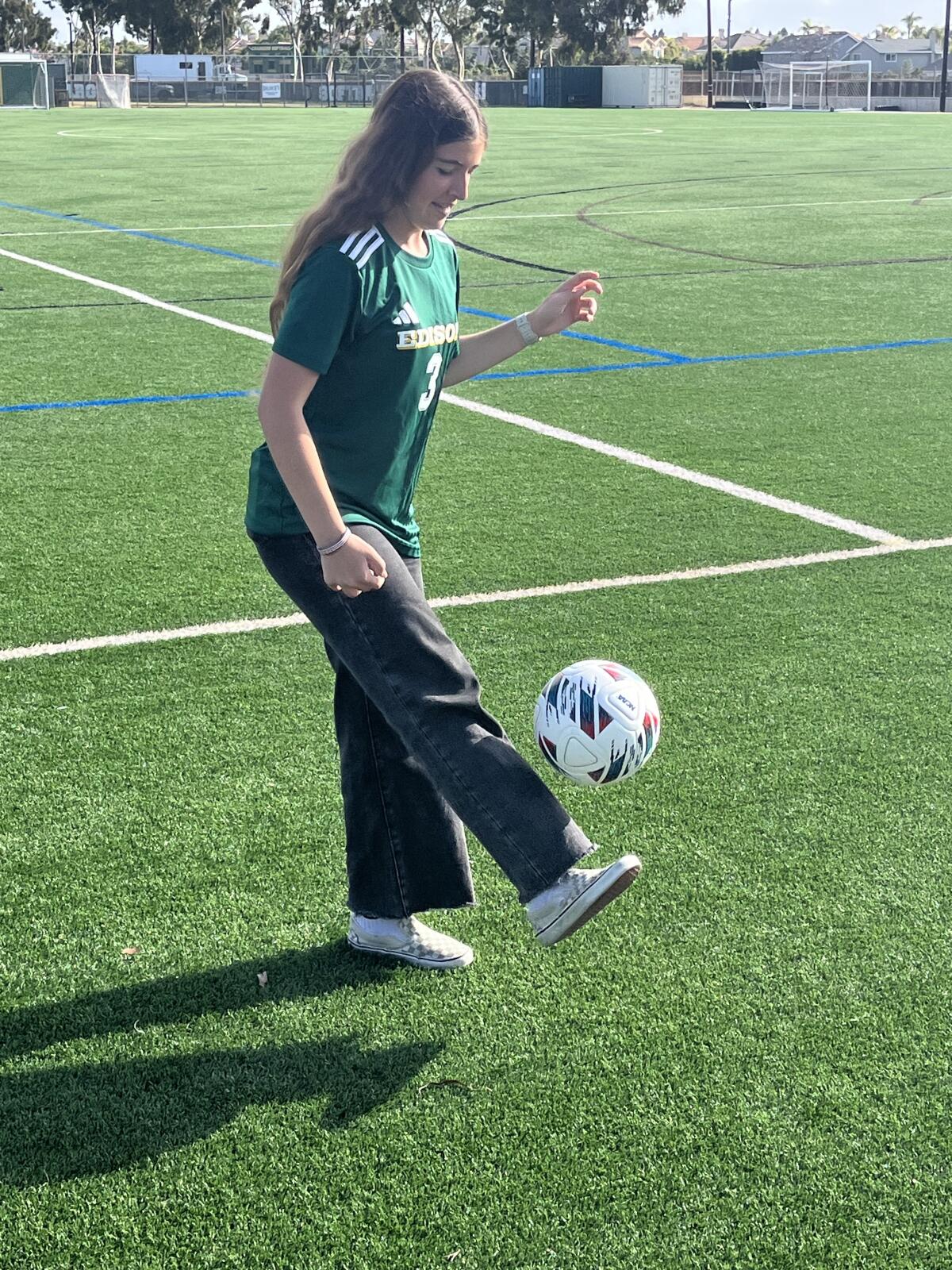 Ashley Sullivan dribbles the ball at the soccer field at Edison High School.