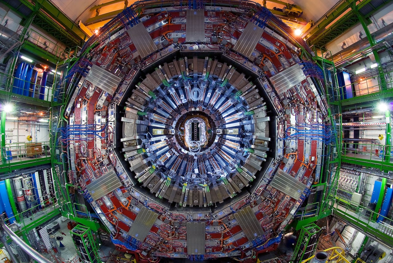 A view of the Compact Muon Solenoid detector at CERN, showing its concentric circular structure and complex wiring.