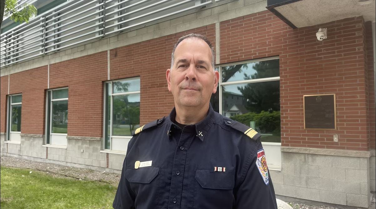A firefighter standing in front of a building.