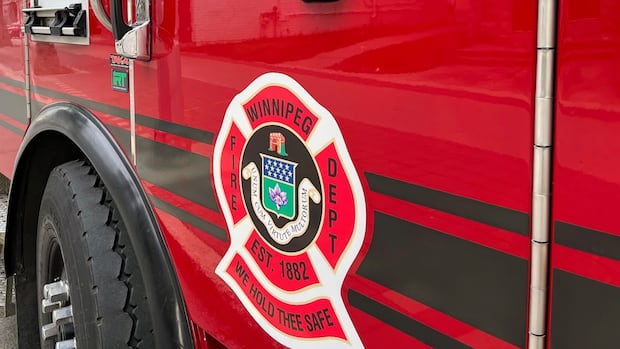 Resident, firefighter taken to hospital after rooming house blaze in Winnipeg's North End