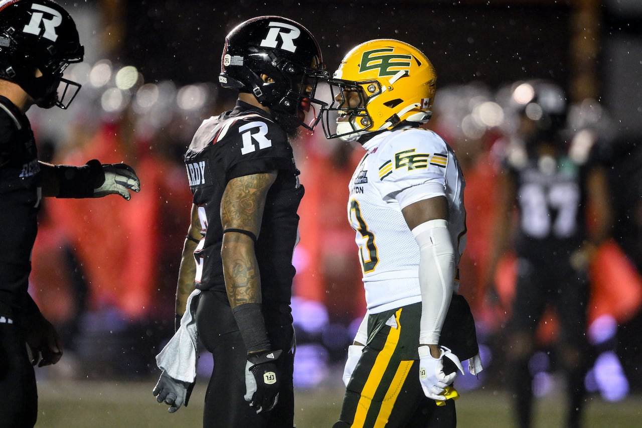 Two football players confronting each other during a game