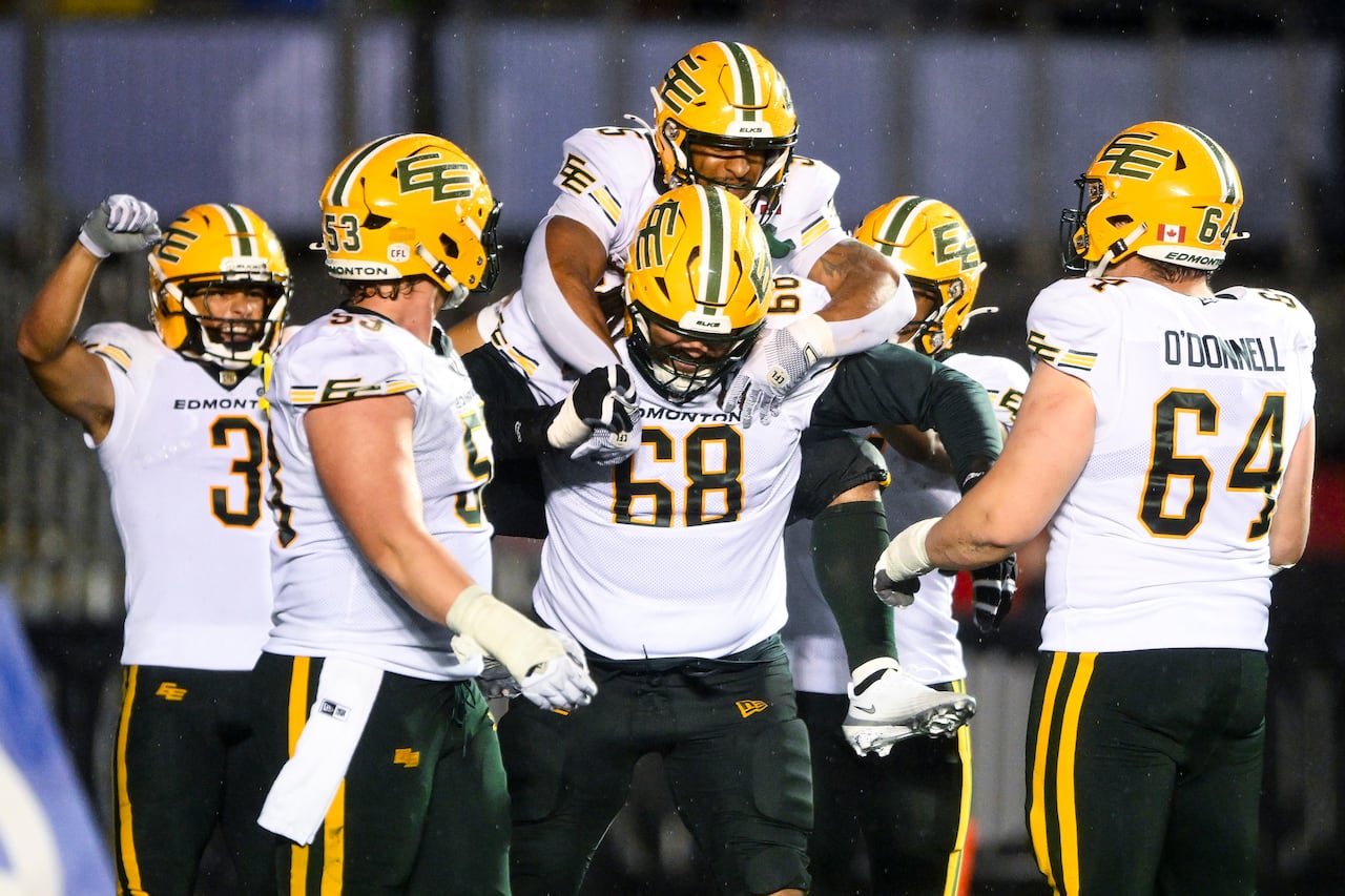 Edmonton Elks football players celebrating after a touchdown