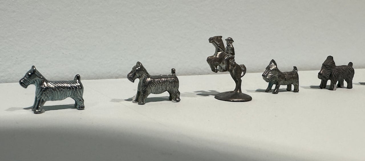 Various Monopoly playing pieces.