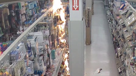 Photo of a fire burning inside of a store.