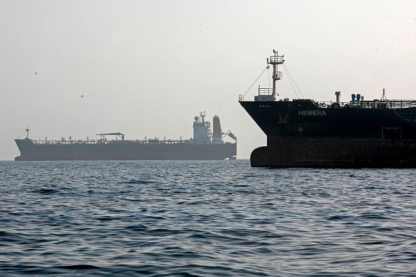 Two cargo ships at sea.