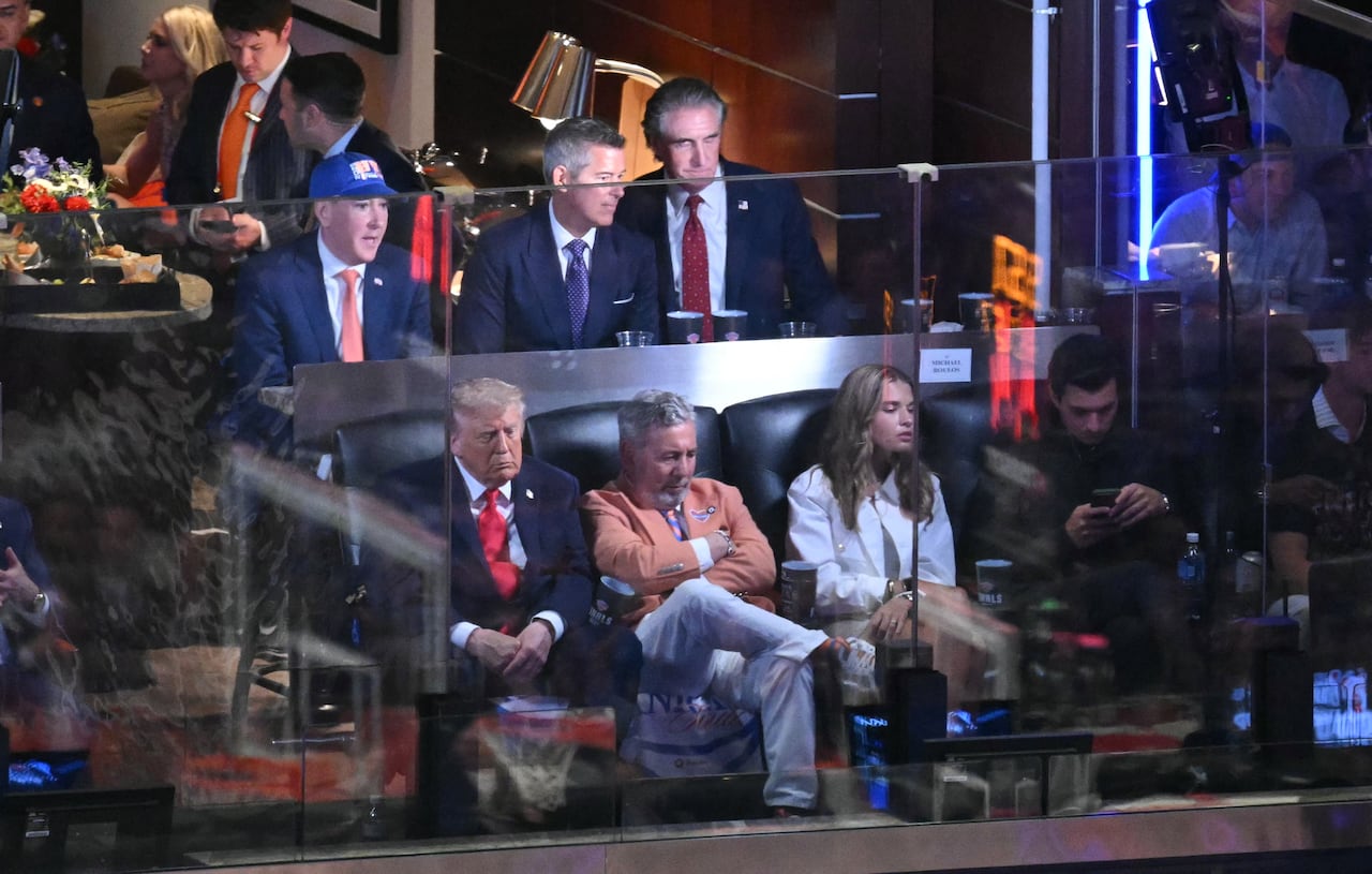 People in a suite at an arena.