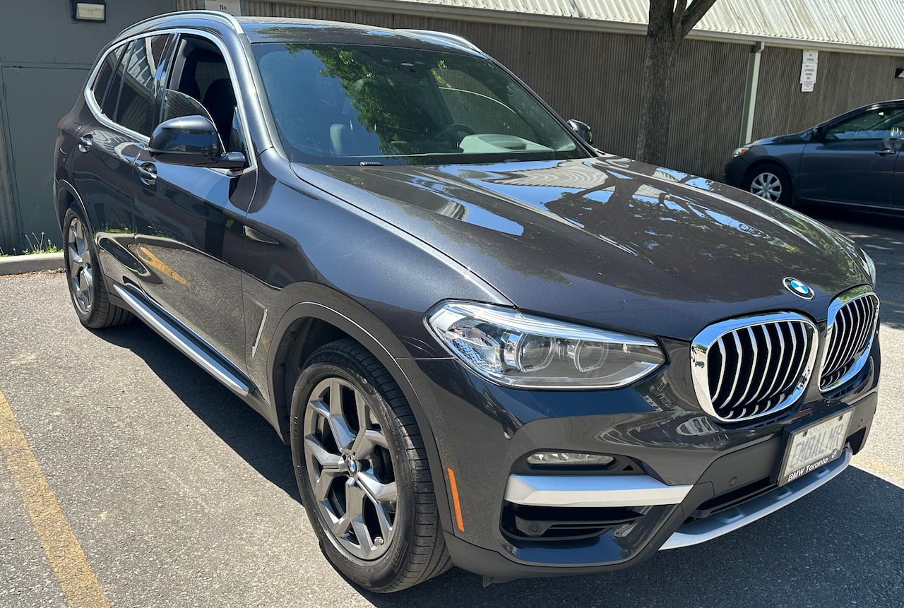 Zack Giacomelli 2021 BMW parked in a parking lot.