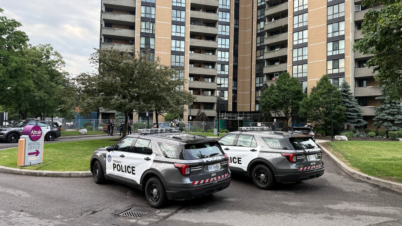Police vehicles outside an apartment.