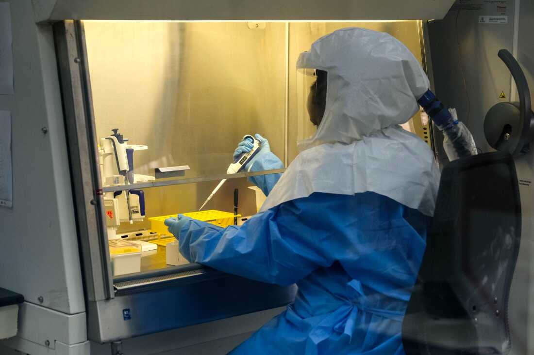 Sophia Mulei, a laboratory technologist, works with a control sample inside the Viral Hemorrhagic Fever Laboratory at Uganda Virus Research Institute in Entebbe, Uganda. The lab is one of the primary centers for the testing of Ebola samples.