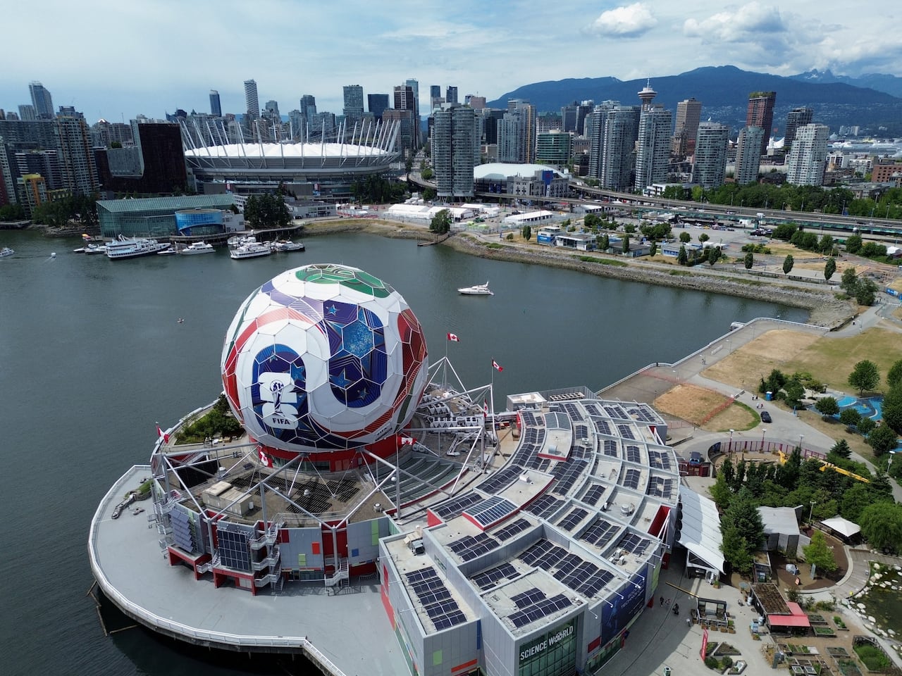 An aerial view of Vancouver where the Science World dome has been transformed into a 360-degree match ball.
