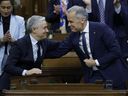Minister of Finance Francois-Philippe Champagne embraces Prime Minister Mark Carney while presenting the Spring Economic Update in the House of Commons on April 28, 2026. 