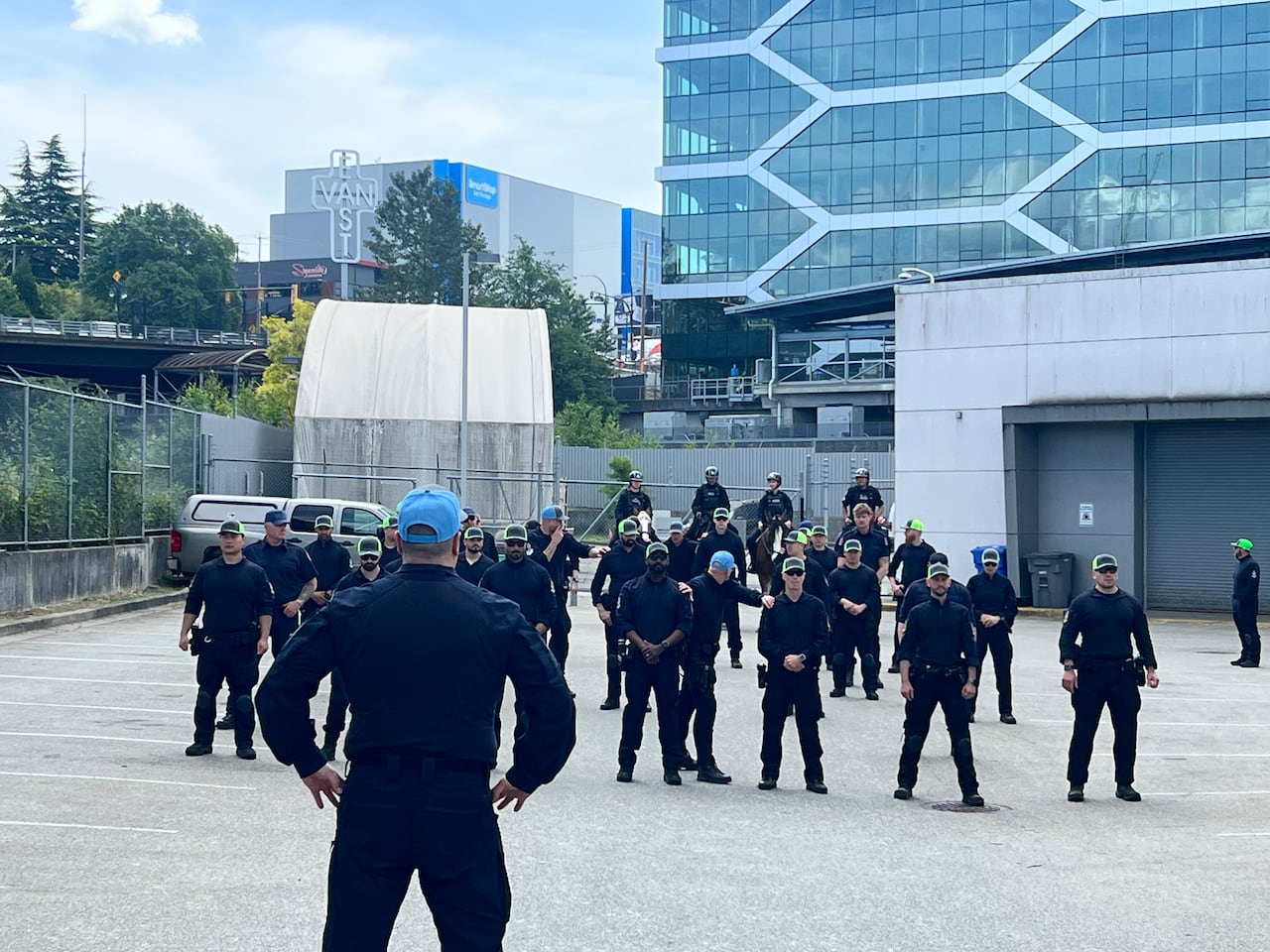 A bunch of police officers stand in rows