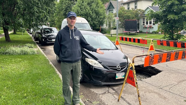What a way to wake up! Winnipeg man finds his car slumped in sinkhole