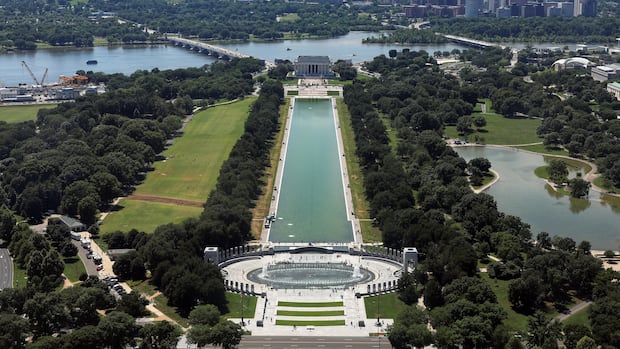 Trump spent $14M US to make reflecting pool look blue. Now the water is green