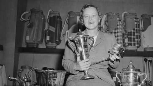 Patty Berg Holding Her Trophies