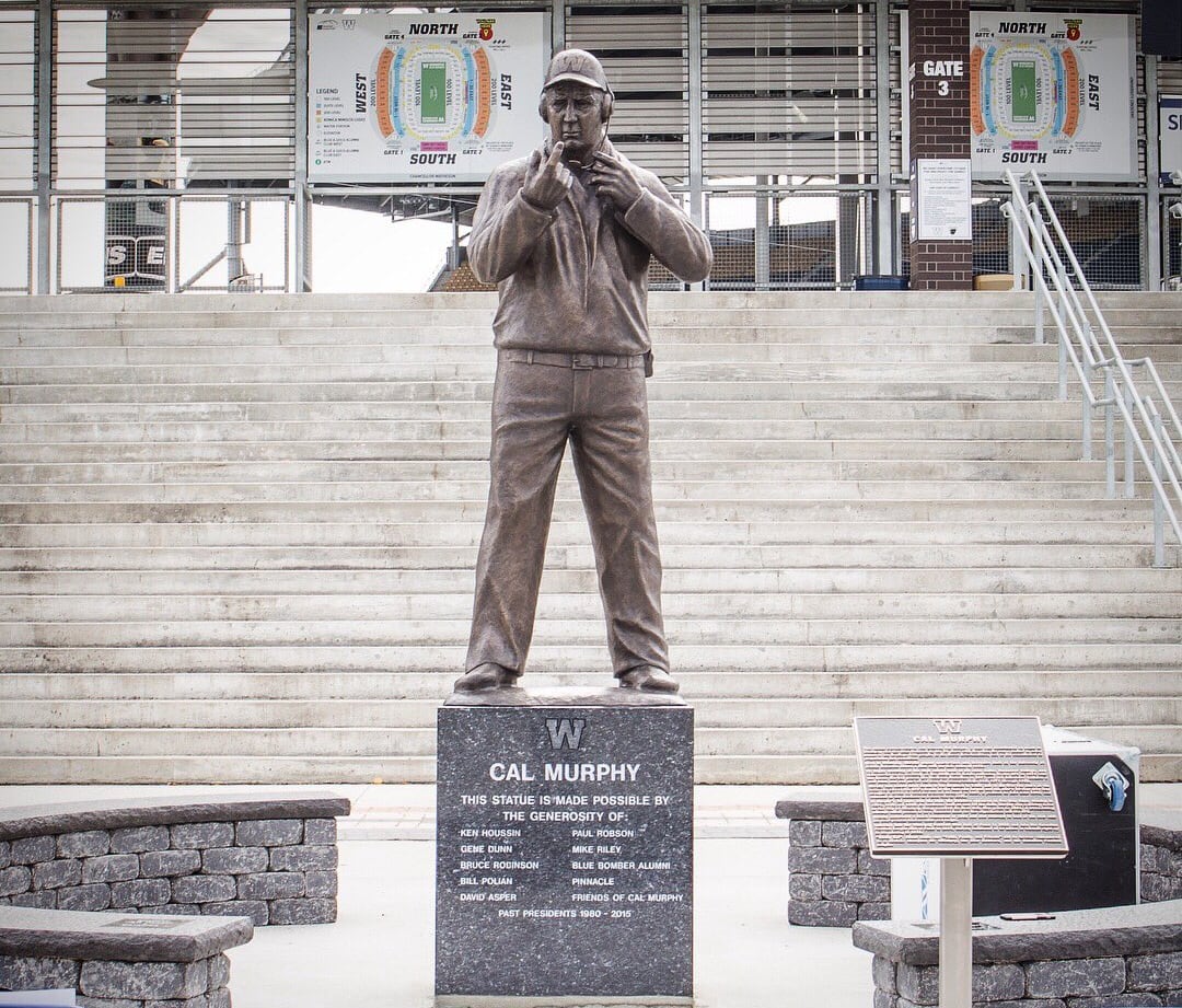 A statue outside of a football stadium