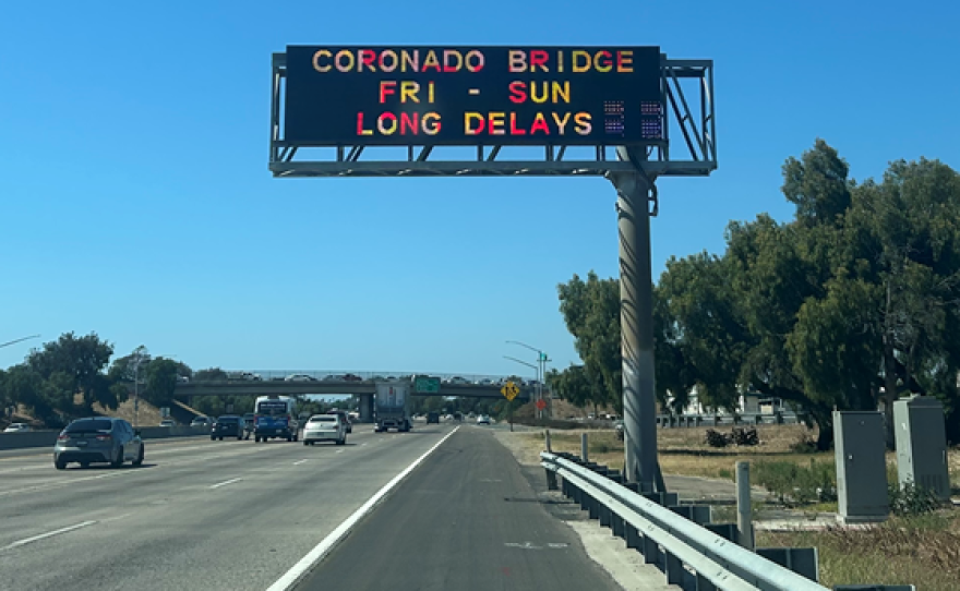 Photo of a sign on Interstate 5 that says "CORONADO BRIDGE FRI - SUN LONG DELAYS."