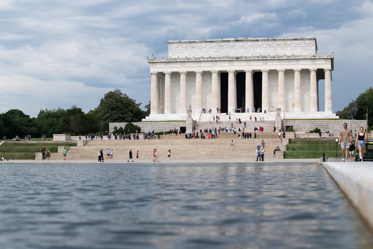 A view of the Lincoln Memorial in Washington, D.C., with a portion of the reflecting pool seen in the foreground of the image.