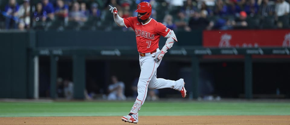 Jo Adell rounds the bases after a home run.