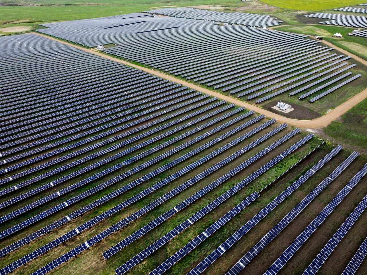 a aerial view of solar panels on a field