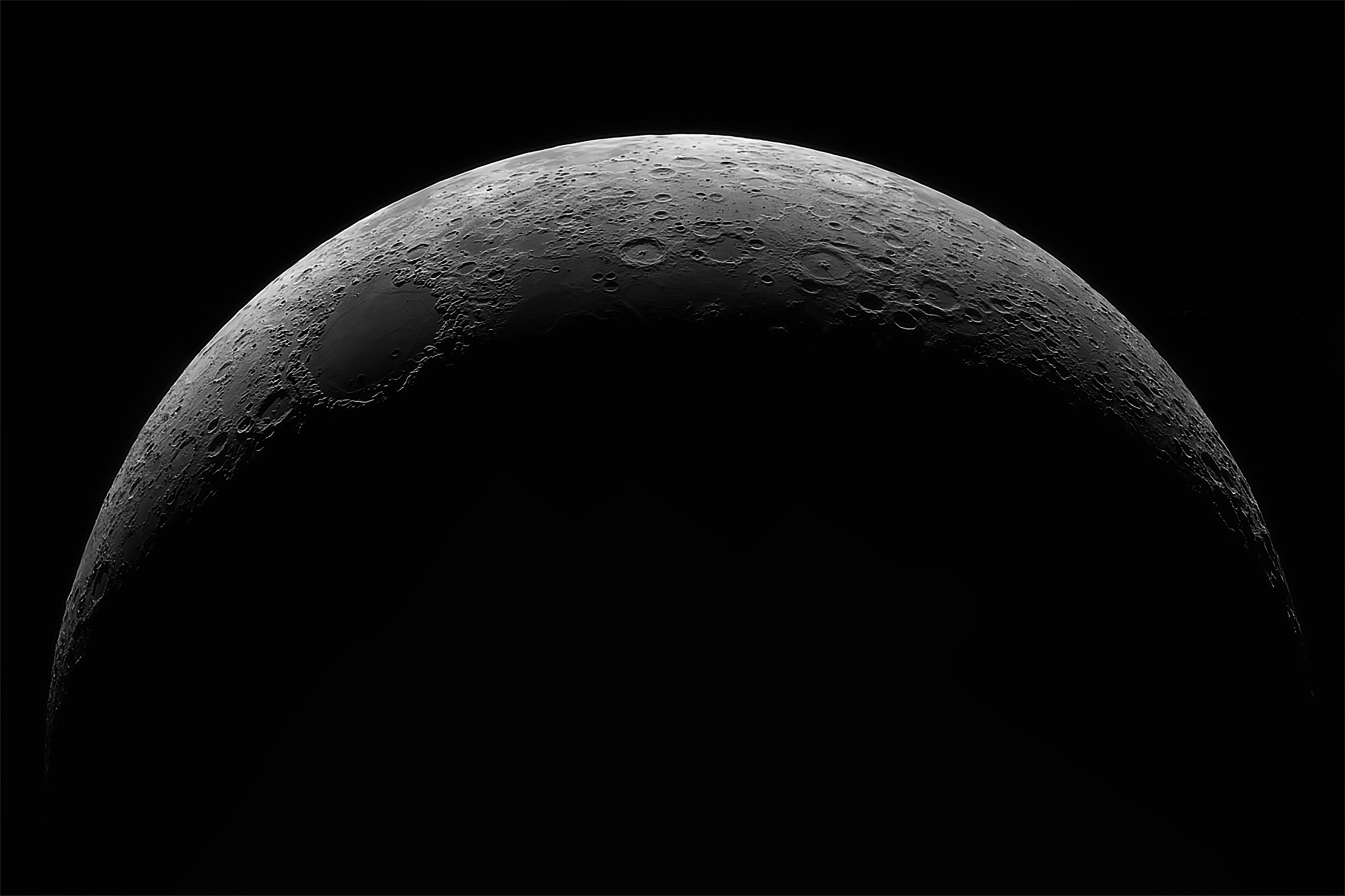 The moon at night in black and white.