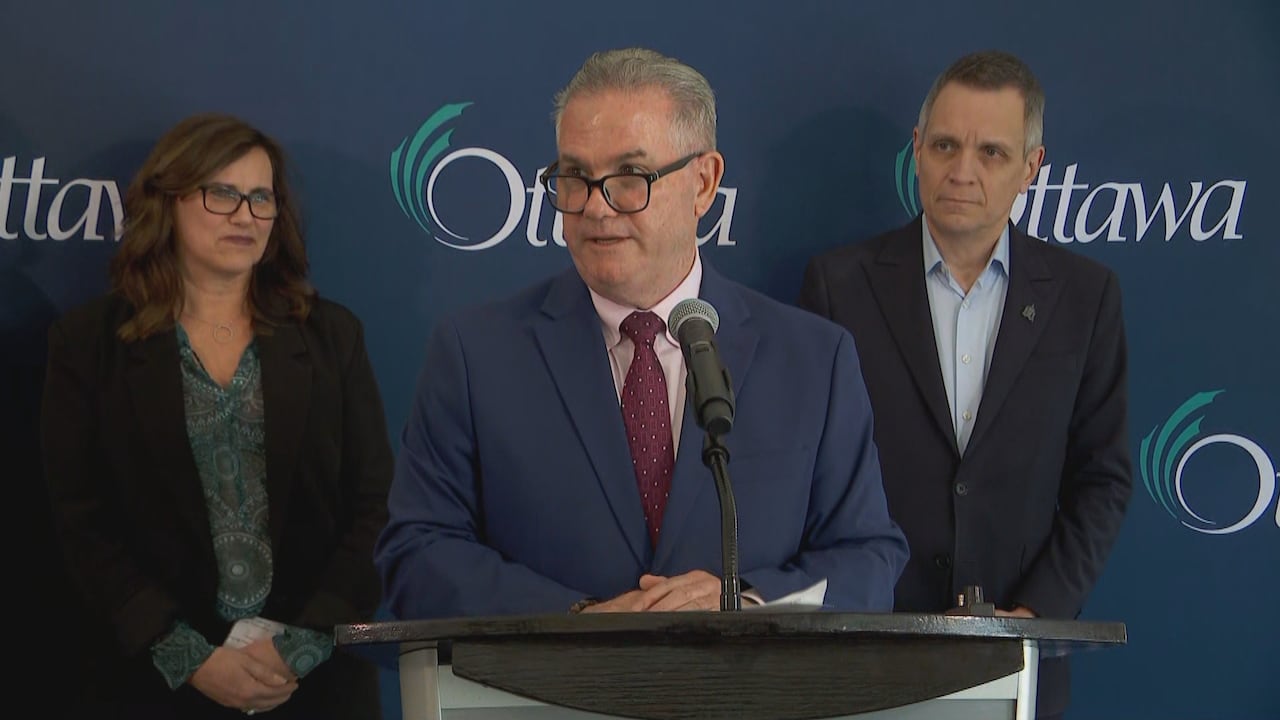 A city executive speaks to reporters at a news conference.