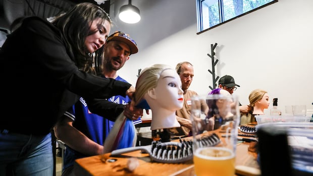 Winnipeg dads learn how to braid their daughters' hair as they bond over beers