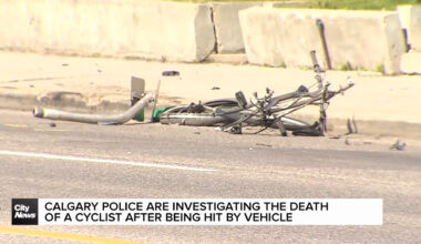 Calgary Police are investigating the death of a cyclist after being hit by vehicle
