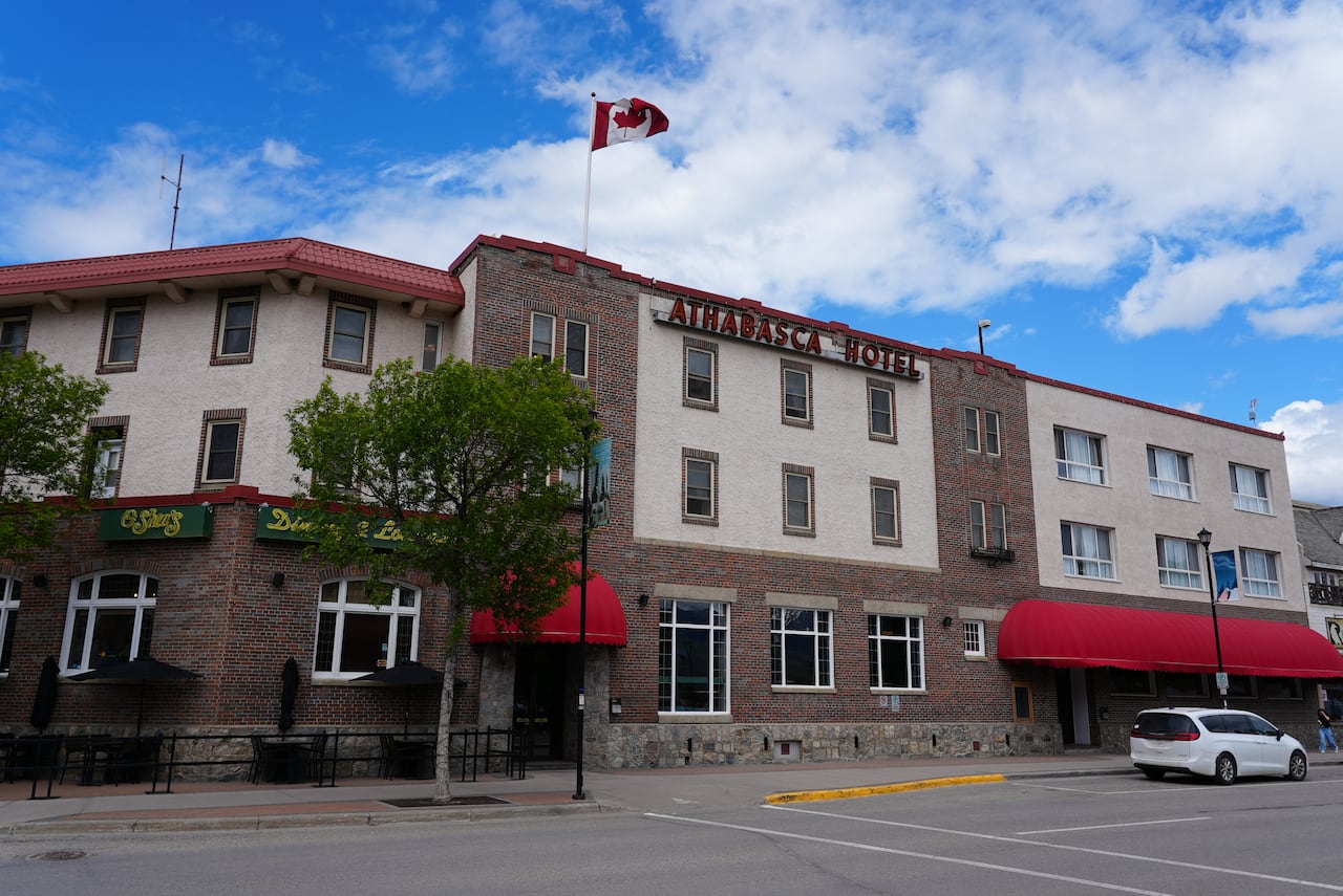 A brick building with a Canadian flag.