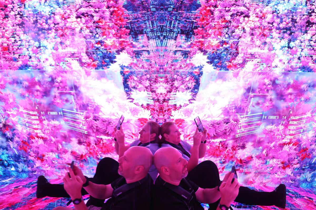 Benjamin Feinberg and his wife Amy, are immersed in the Infinity room.