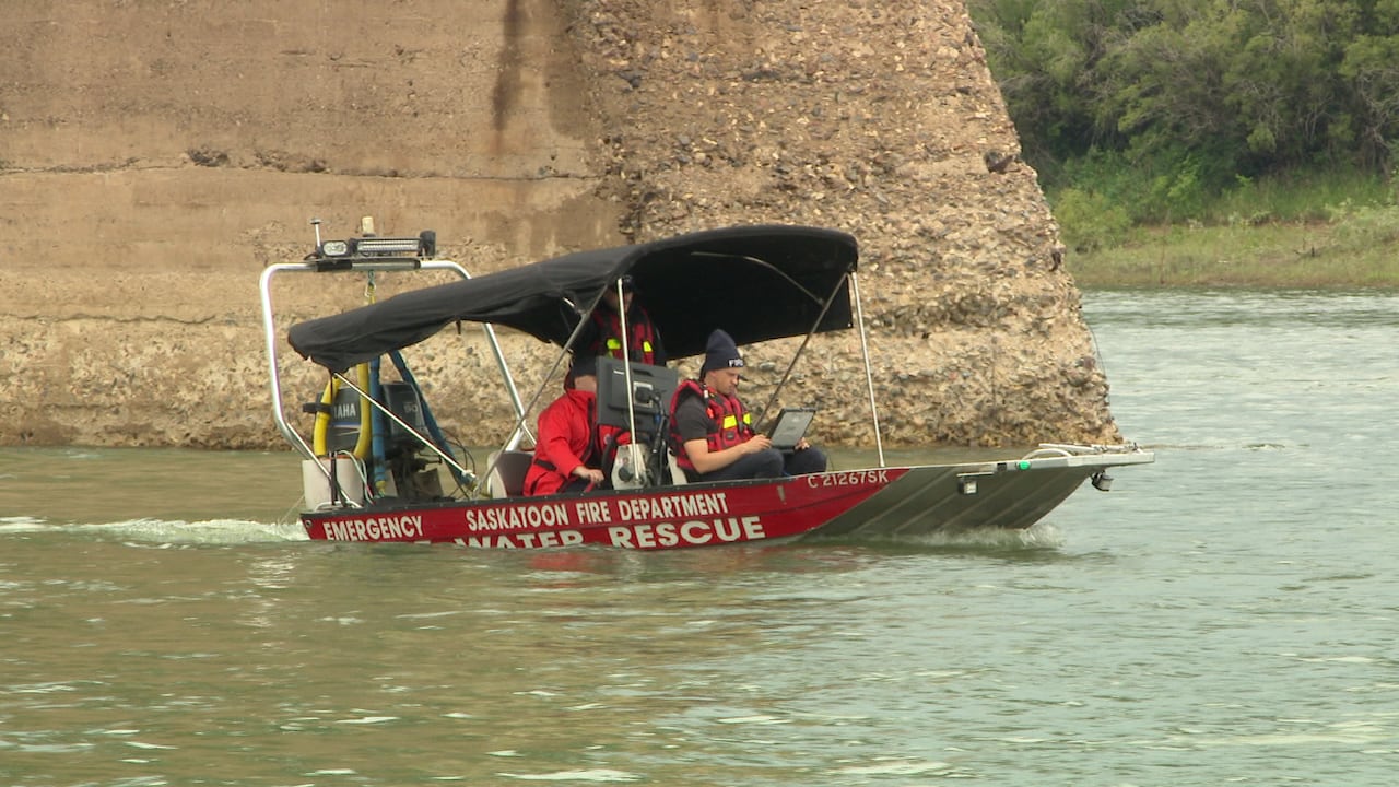 Saskatoon Fire Department boat and rescue team scour the river.