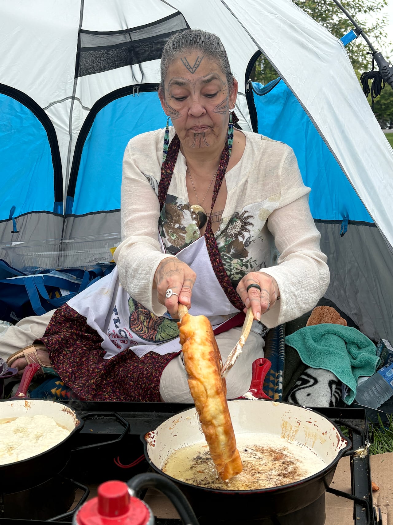 Gerri Sharpe has made bannock at nearly every Indigenous Peoples Day for 30 years. This year she served up the fried treat on behalf of the Northwest Territories Human Rights Commission.