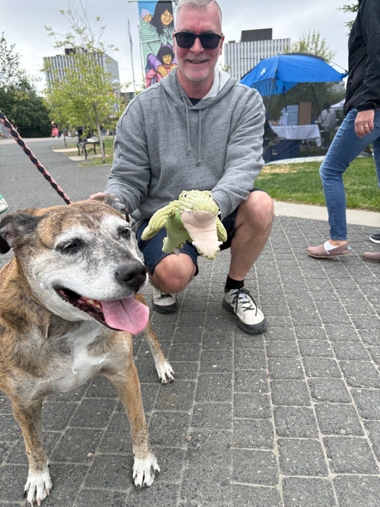Tiger, left, had her uncle Chris Bock on hand to carry her favourite crocodile toy while she greeted people at Somba K'e Park during the annual Indigenous Peoples Day celebrations.