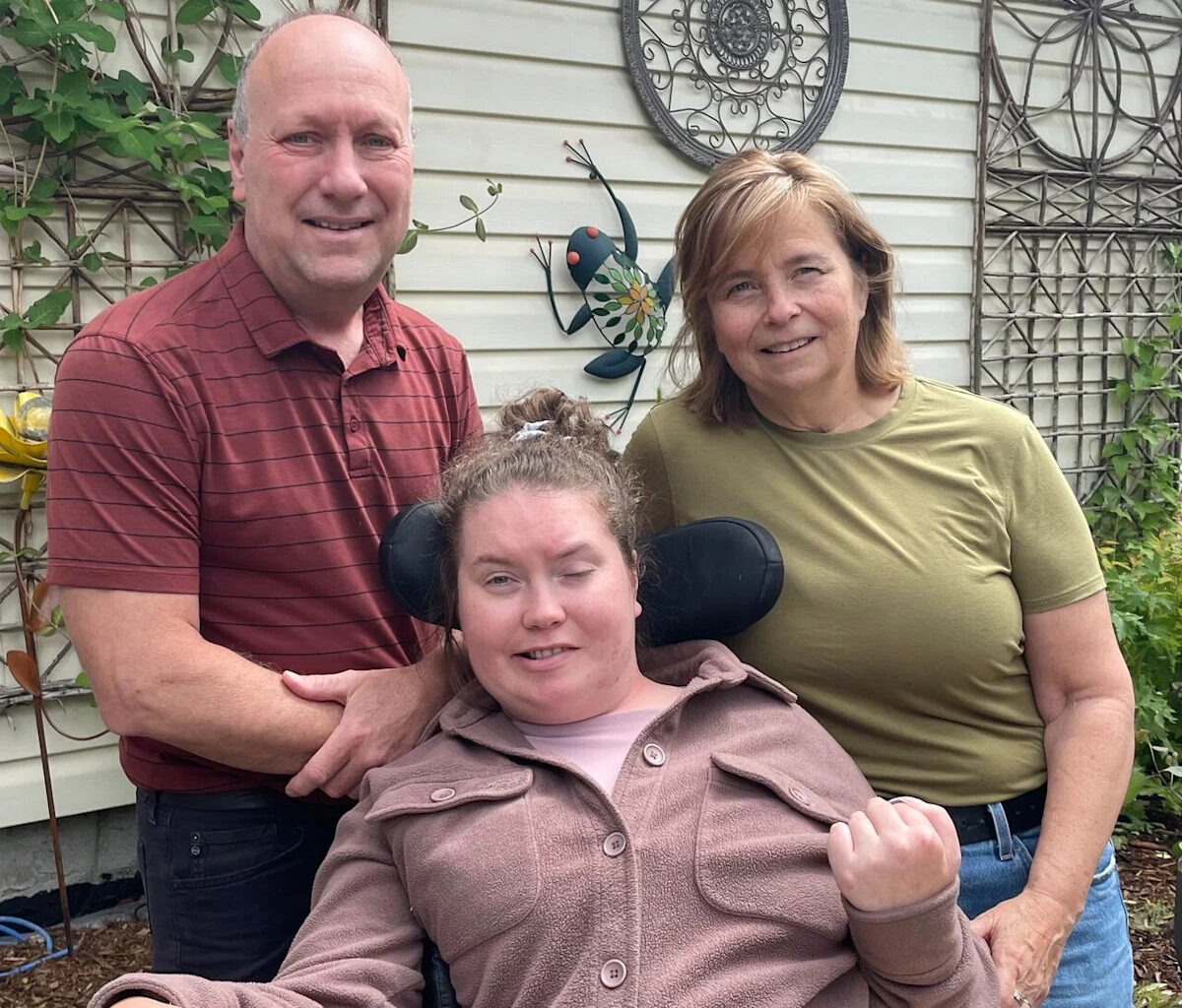 Calgary family shocked to discover their daughter, with severe brain injury, is being moved off AISH