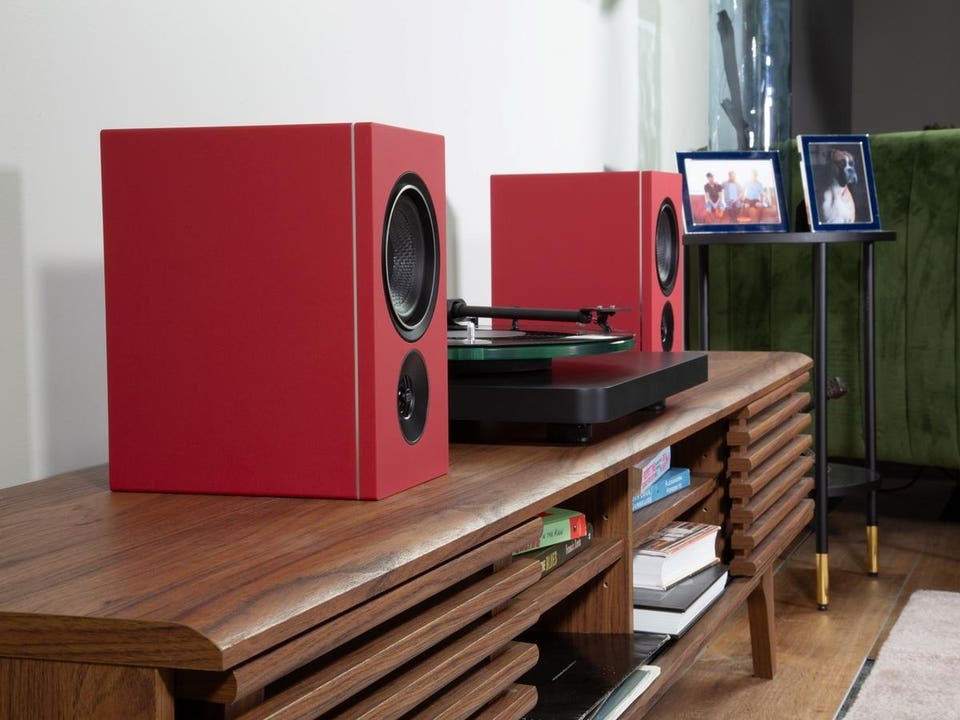 Red PSB iQ2 speakers with turntable
