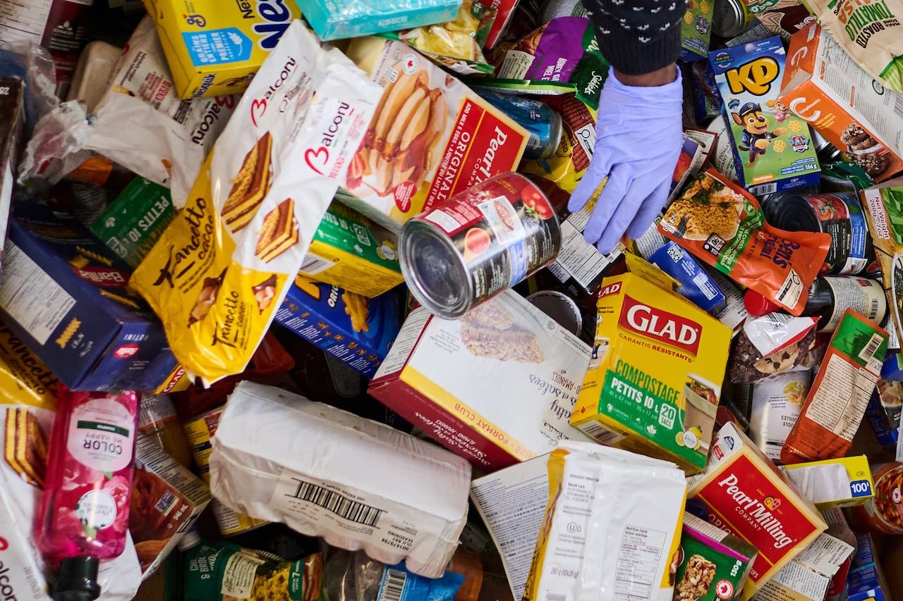 Volunteers sort and pack food donations at the Daily Bread Food Bank’s spring public food sort in Toronto, on Saturday, April 4, 2026. THE CANADIAN PRESS/Sammy Kogan