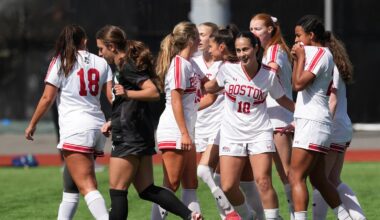 Photo of BUWomen's Soccer seniors Margy Porta and Mackenzie Stickelman embracing following a Patriot League semifinal win.