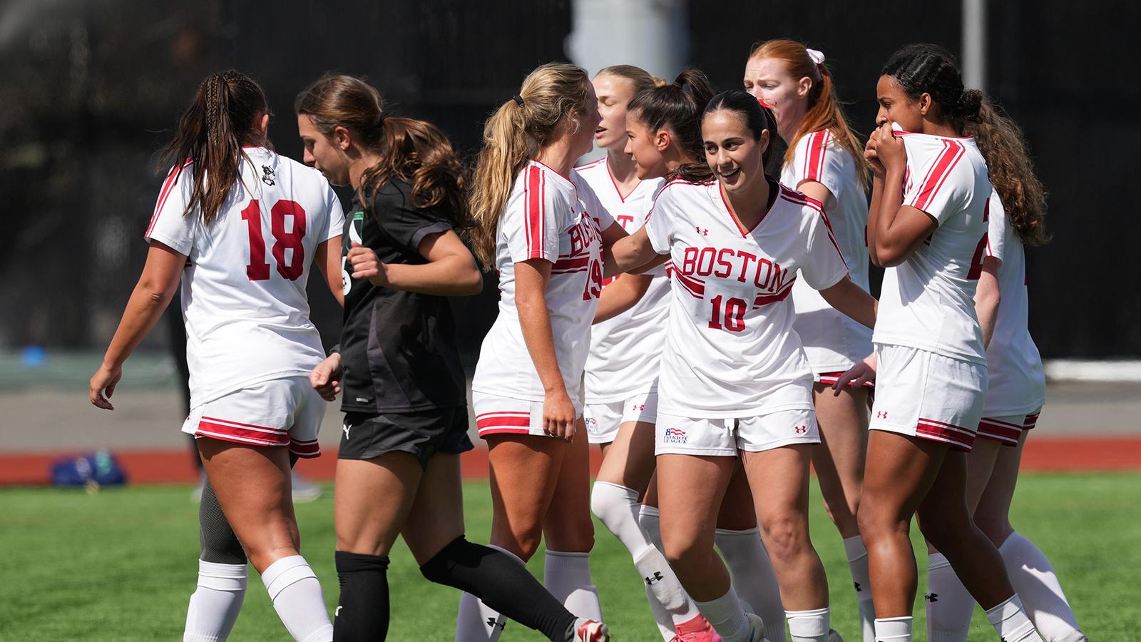 Photo of BUWomen's Soccer seniors Margy Porta and Mackenzie Stickelman embracing following a Patriot League semifinal win.