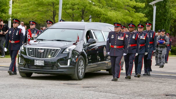 Family, Toronto police officers honour Const. Marc Pinizzoto, who was killed during investigation