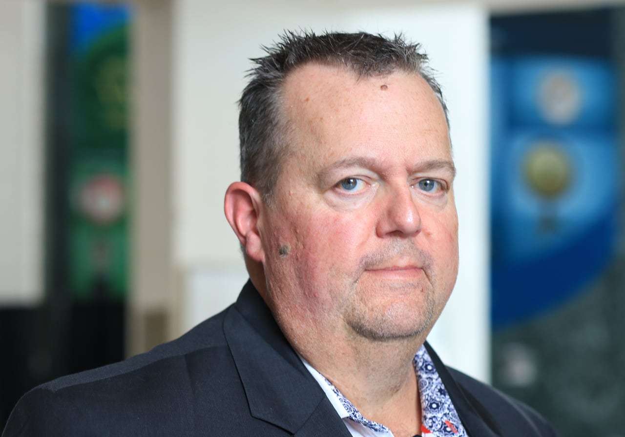 A photo of Hydro Ottawa CEO Bryce Conrad at Ottawa City Hall. 