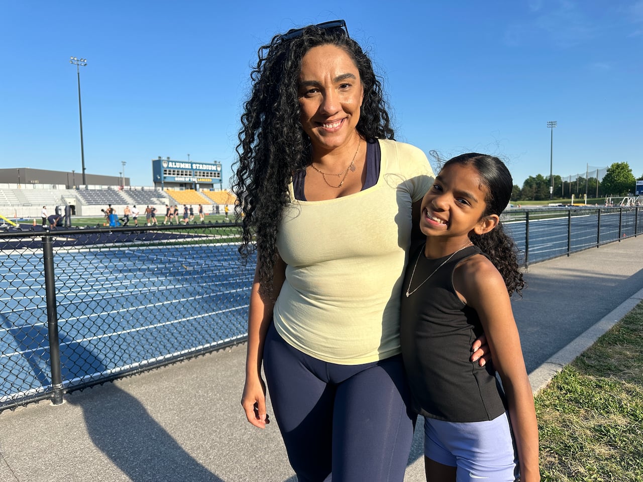 A woman next to her daughter.