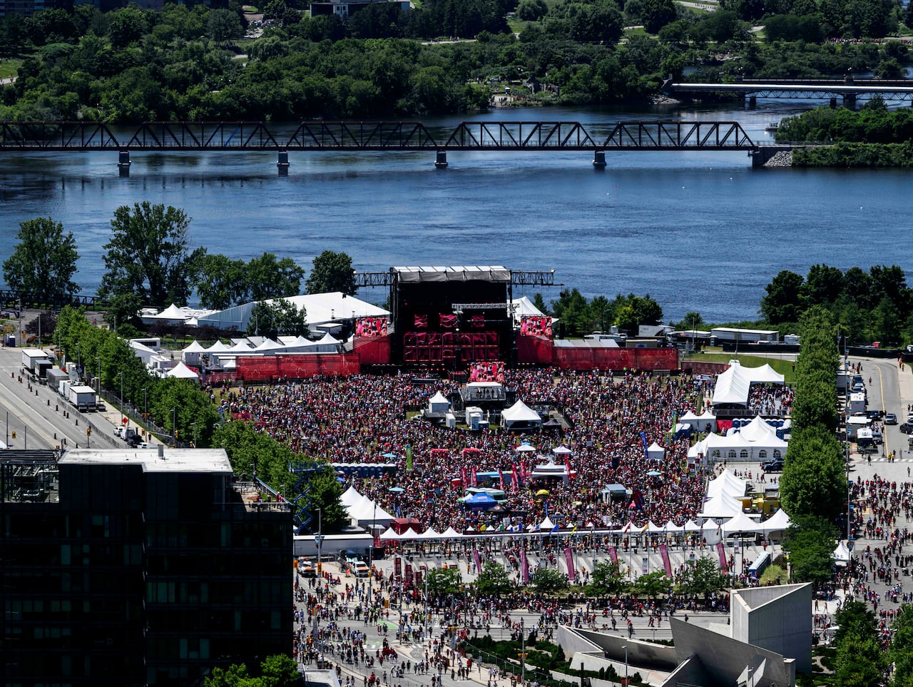 An overhead view of an event at a big outdoor stage.