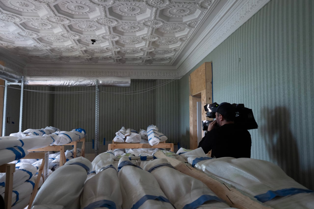 A camera man records images in the dining room during a tour of the official residence of the Prime Minister of Canada, 24 Sussex Dr. in Ottawa, Friday, June 26, 2026.