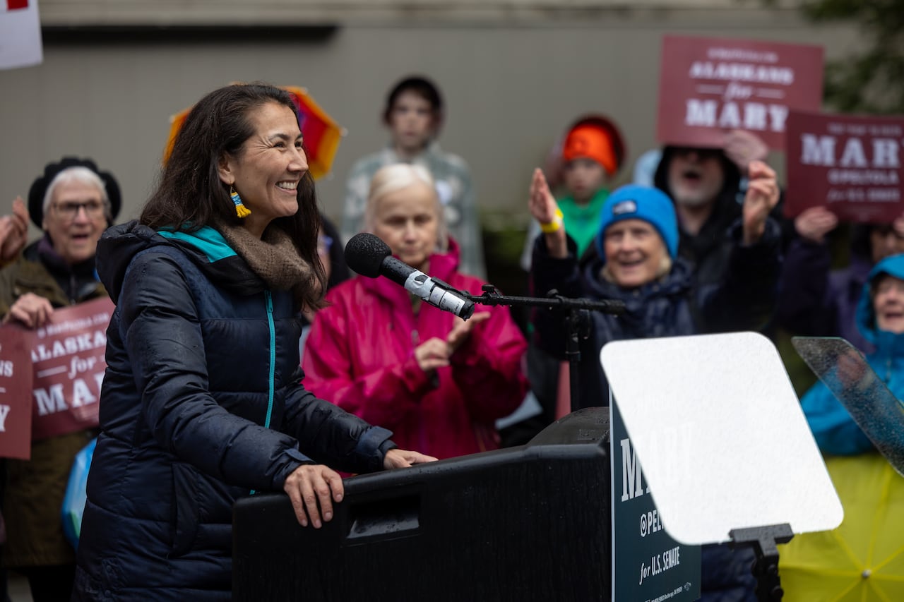 A politician surrounded by supporters