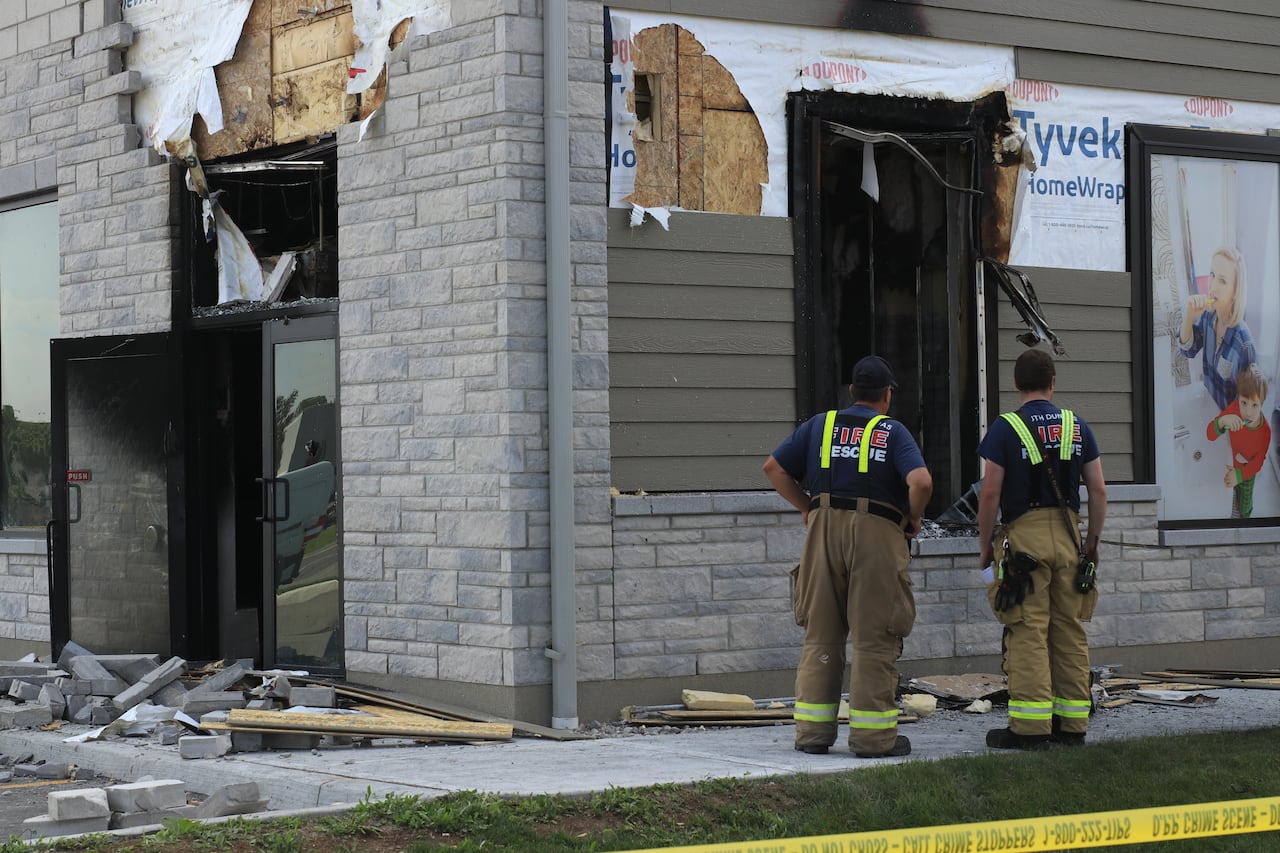 A business in Iroquois, Ont., was damaged by fire Monday. Police believe that scene is connected to the murder-suicide.