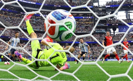 Lionel Messi scores their first goal past Austria’s Alexander Schlager.