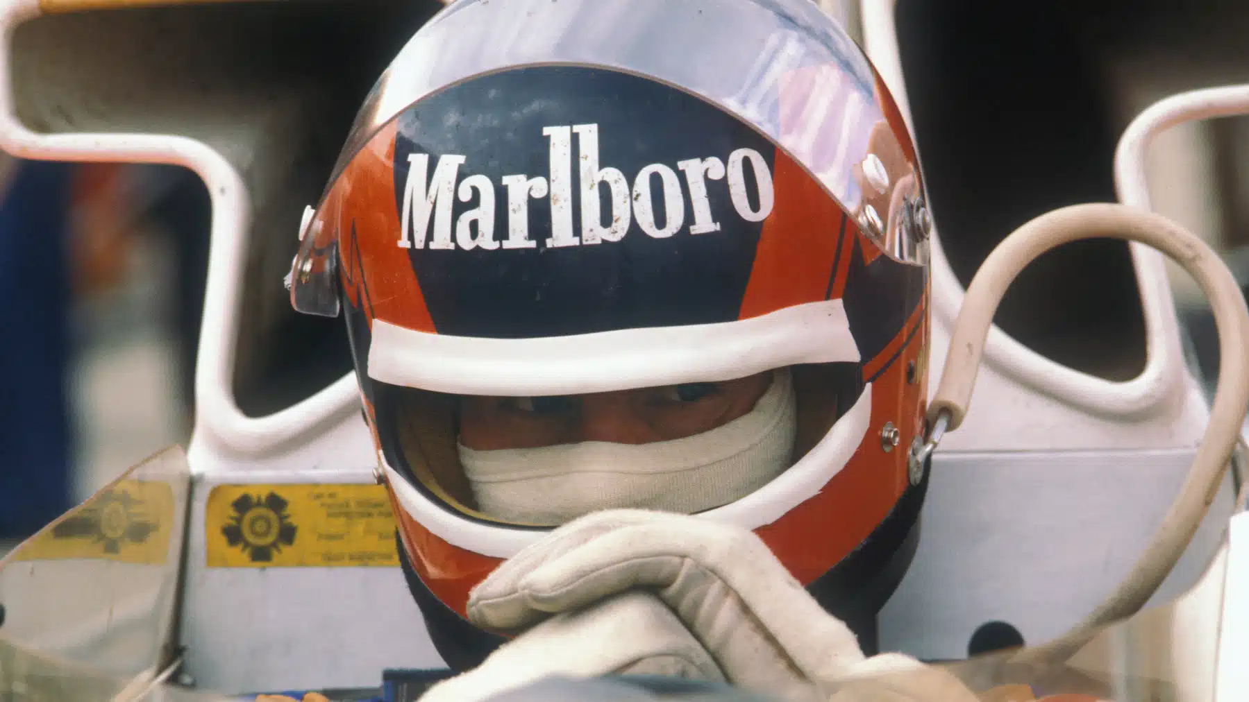 Gilles Villeneuve (McLaren-Ford) with his helmet on during practice for the 1977 British Grand Prix